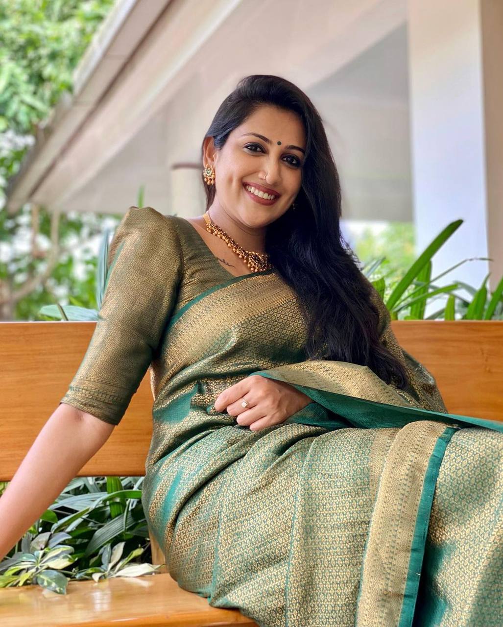 Mitera Green Woven Designer Party Wear Soft Silk Lichi Silk Saree .