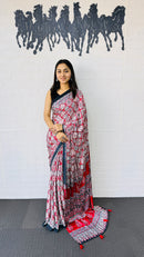 Vibrant Red Ajrakh-Inspired Printed Saree with Traditional Border & Tassel Detailing