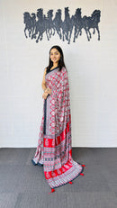 Vibrant Red Ajrakh-Inspired Printed Saree with Traditional Border & Tassel Detailing