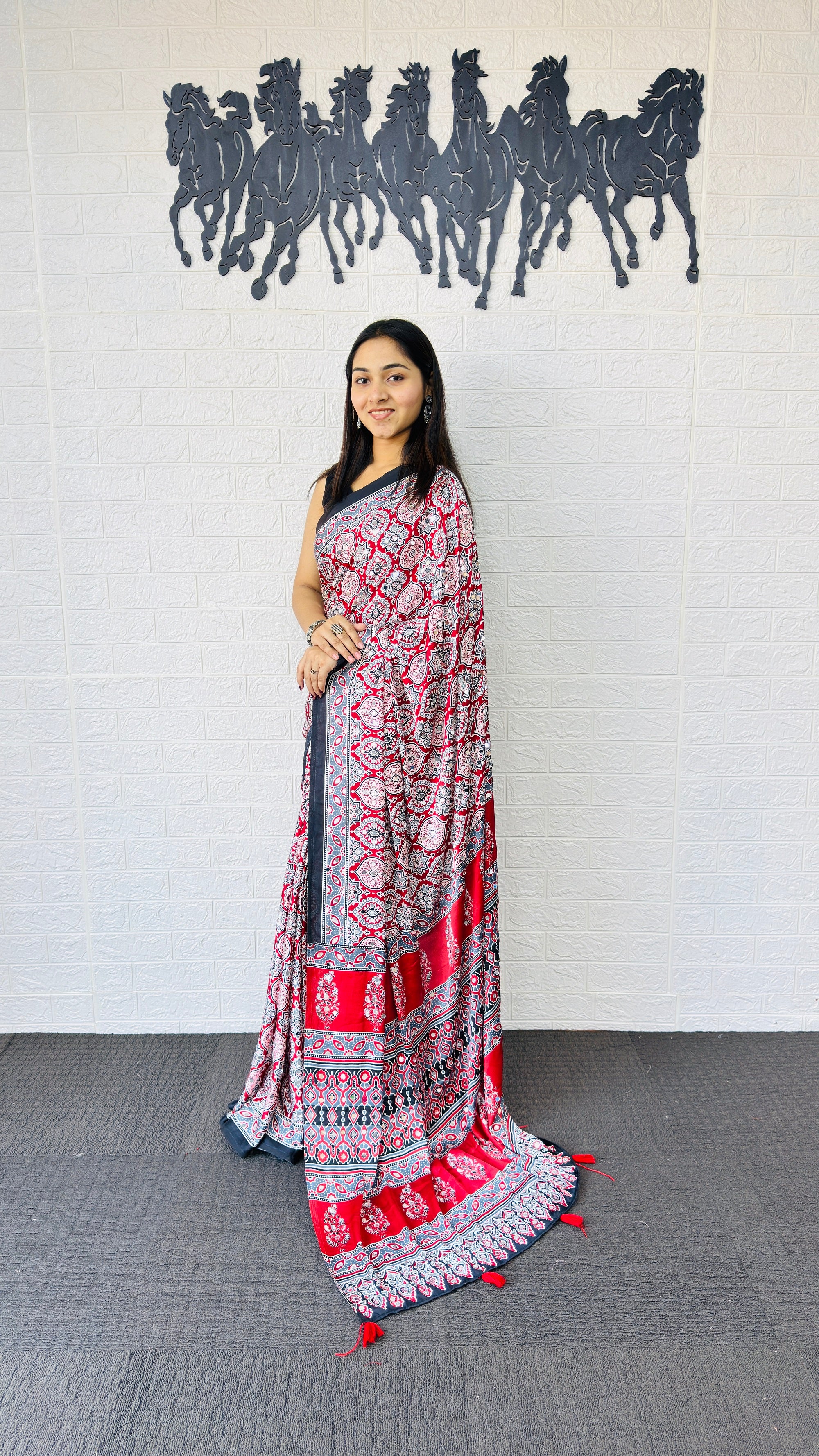Vibrant Red Ajrakh-Inspired Printed Saree with Traditional Border & Tassel Detailing