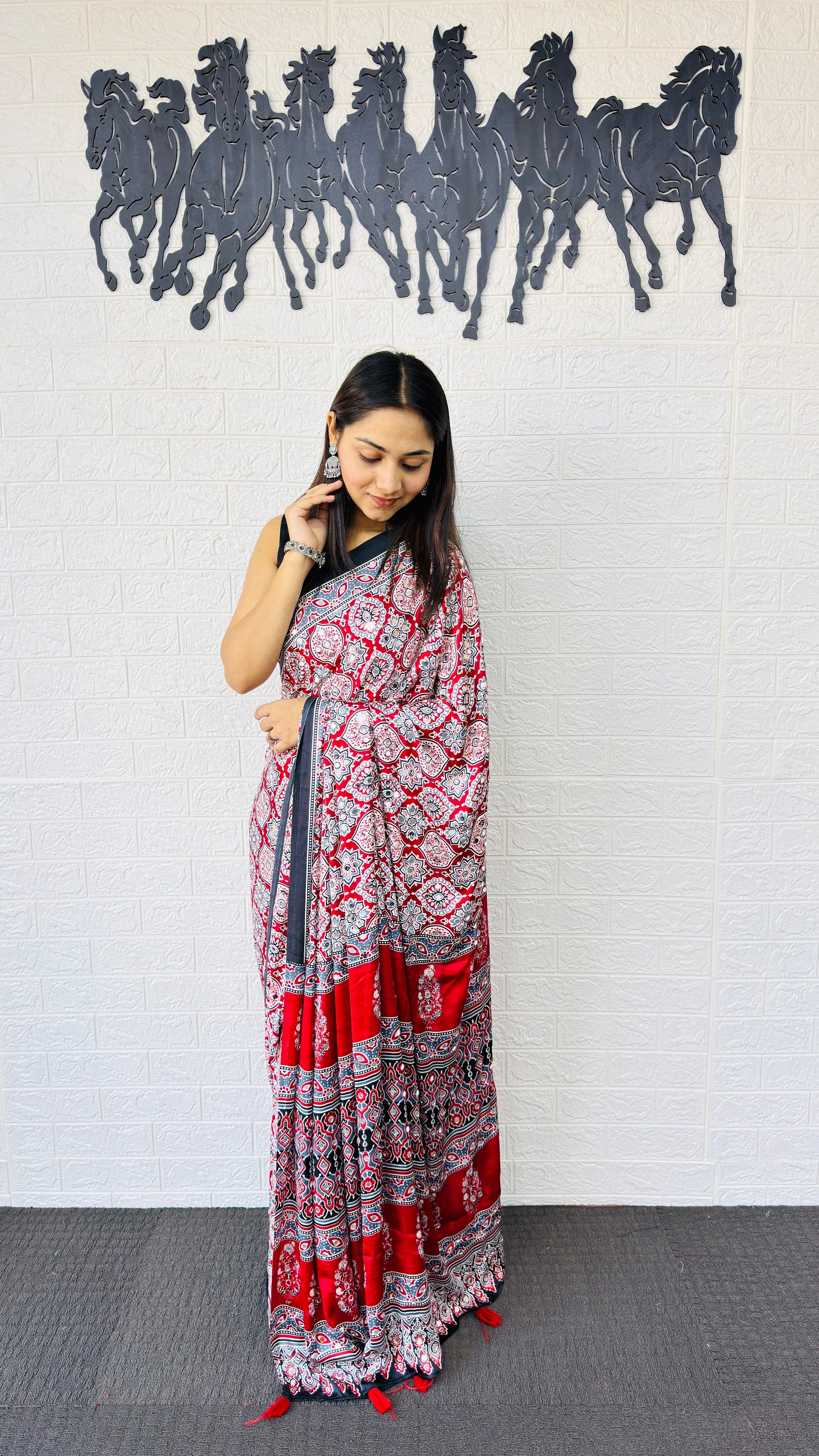 Vibrant Red Ajrakh-Inspired Printed Saree with Traditional Border & Tassel Detailing