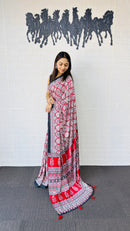 Vibrant Red Ajrakh-Inspired Printed Saree with Traditional Border & Tassel Detailing