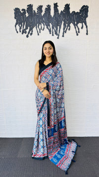 Graceful Indigo Blue Ajrakh-Inspired Printed Saree with Ethnic Border & Tassel Detailing