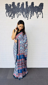Graceful Indigo Blue Ajrakh-Inspired Printed Saree with Ethnic Border & Tassel Detailing