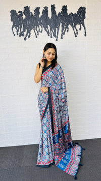 Graceful Indigo Blue Ajrakh-Inspired Printed Saree with Ethnic Border & Tassel Detailing