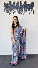 Graceful Indigo Blue Ajrakh-Inspired Printed Saree with Ethnic Border & Tassel Detailing