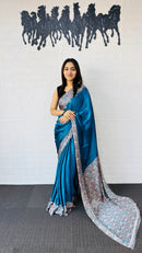 Graceful Teal Blue Designer Saree with Classic Paisley Printed Border