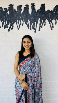 Graceful Indigo Blue Ajrakh-Inspired Printed Saree with Ethnic Border & Tassel Detailing