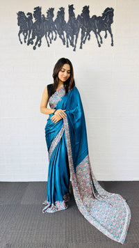 Graceful Teal Blue Designer Saree with Classic Paisley Printed Border