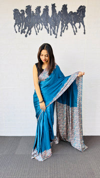 Graceful Teal Blue Designer Saree with Classic Paisley Printed Border
