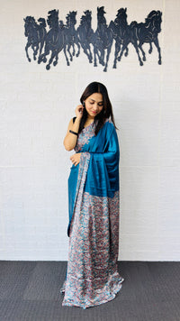 Graceful Teal Blue Designer Saree with Classic Paisley Printed Border