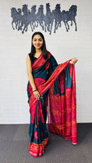 Elegant Teal Blue Designer Saree with Vibrant Pink Heritage Border