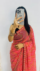 Vibrant Red Zigzag Print Designer Saree with Elegant Lace Border
