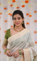 Elegant Ivory White Cotton Saree with Olive Green Border – Minimal Festive Look