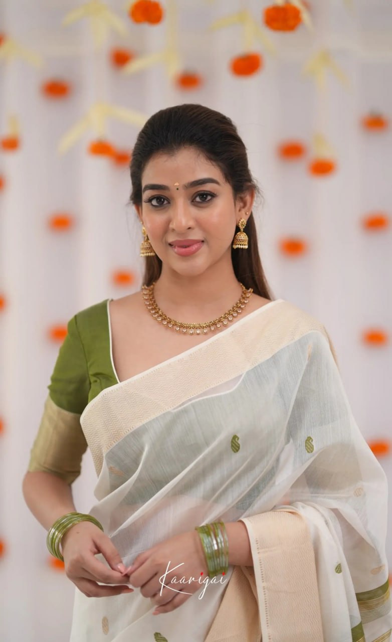 Elegant Ivory White Cotton Saree with Olive Green Border – Minimal Festive Look