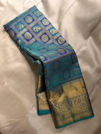 Shimmering Peacock Teal & Gold Kanchipuram Silk Saree with Paisley & Elephant Motifs