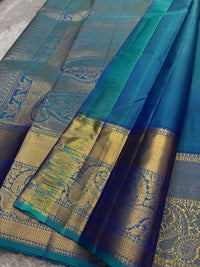 Shimmering Peacock Teal & Gold Kanchipuram Silk Saree with Paisley & Elephant Motifs