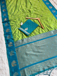 Fresh Lime Green Luxury Silk Saree with Teal Blue Banarasi Peacock Border & Silver Zari Buttas
