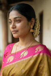 Antique Olive Gold Luxury Silk Saree with Rani Pink Banarasi Peacock Border & Silver Zari Buttas
