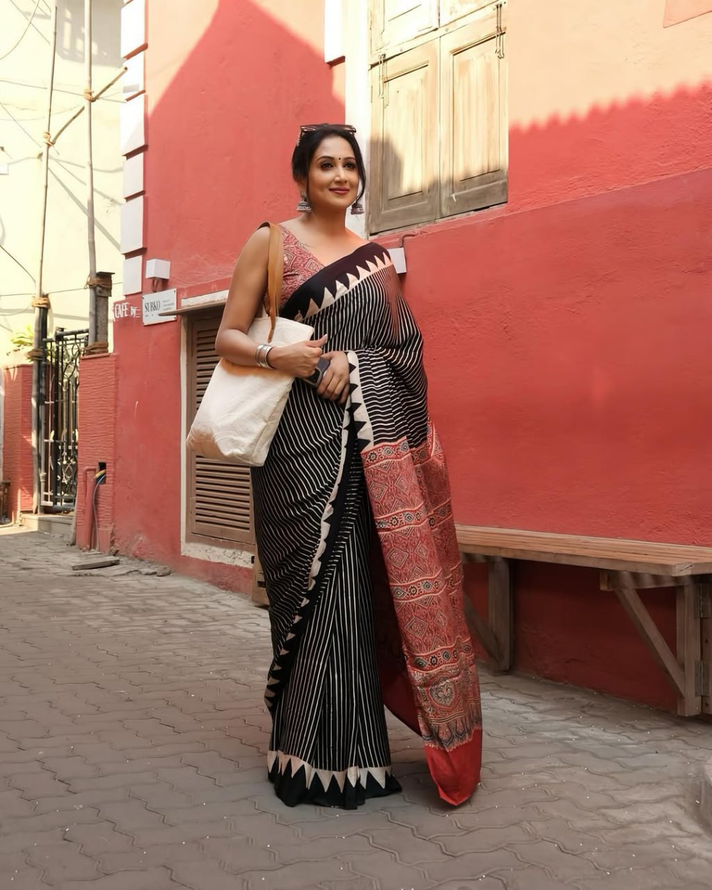 Luxury Black Linen Saree with Ajrakh-Inspired Red Prints & Classic Stripe Pallu