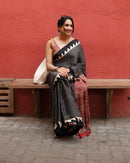 Luxury Black Linen Saree with Ajrakh-Inspired Red Prints & Classic Stripe Pallu