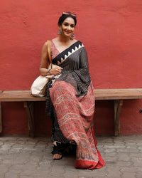 Luxury Black Linen Saree with Ajrakh-Inspired Red Prints & Classic Stripe Pallu