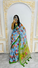 Luxury Sky Blue Linen Saree with Vibrant Floral Prints & Fresh Green Border