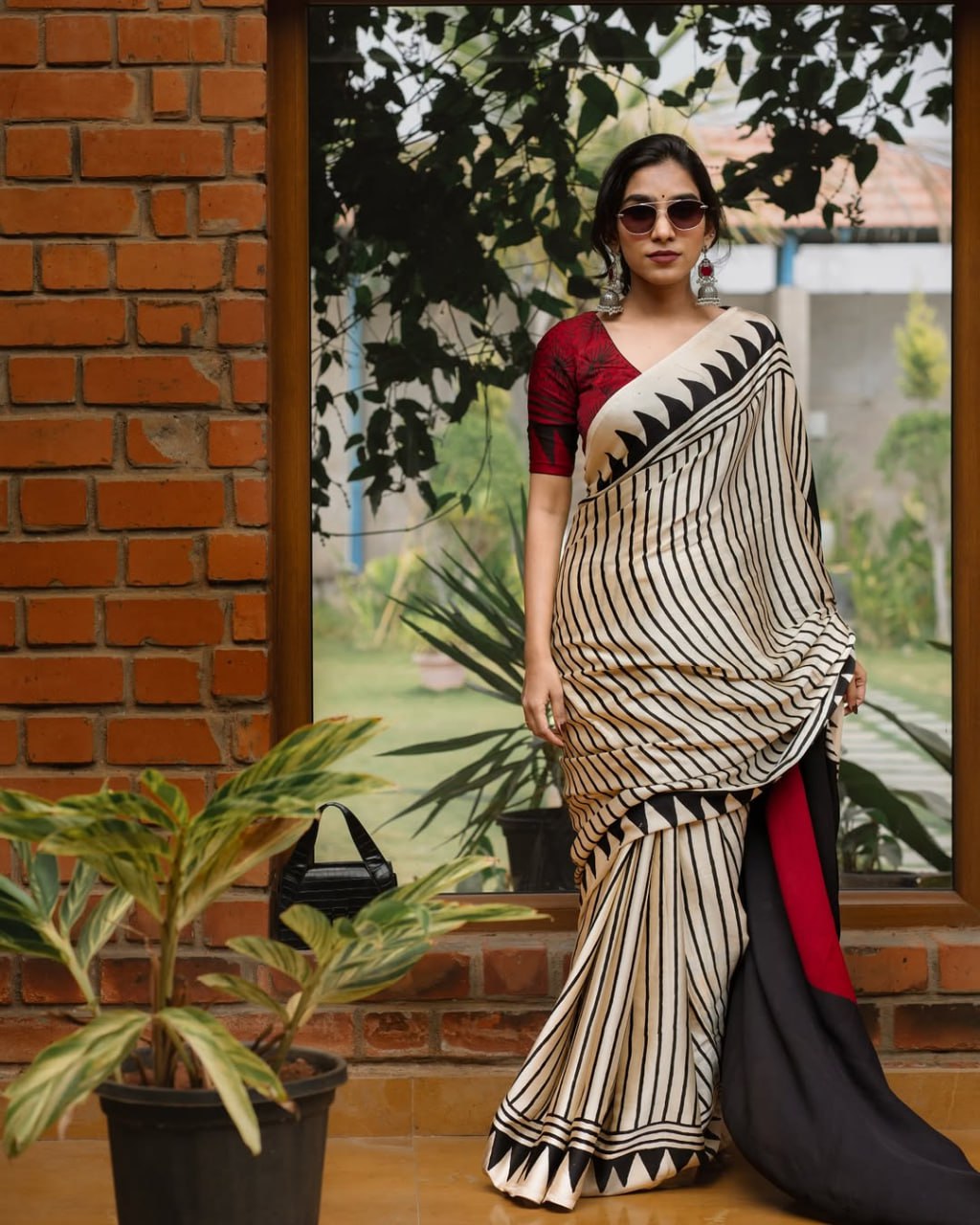 Classic Ivory & Black Striped Designer Saree with Bold Artistic Border