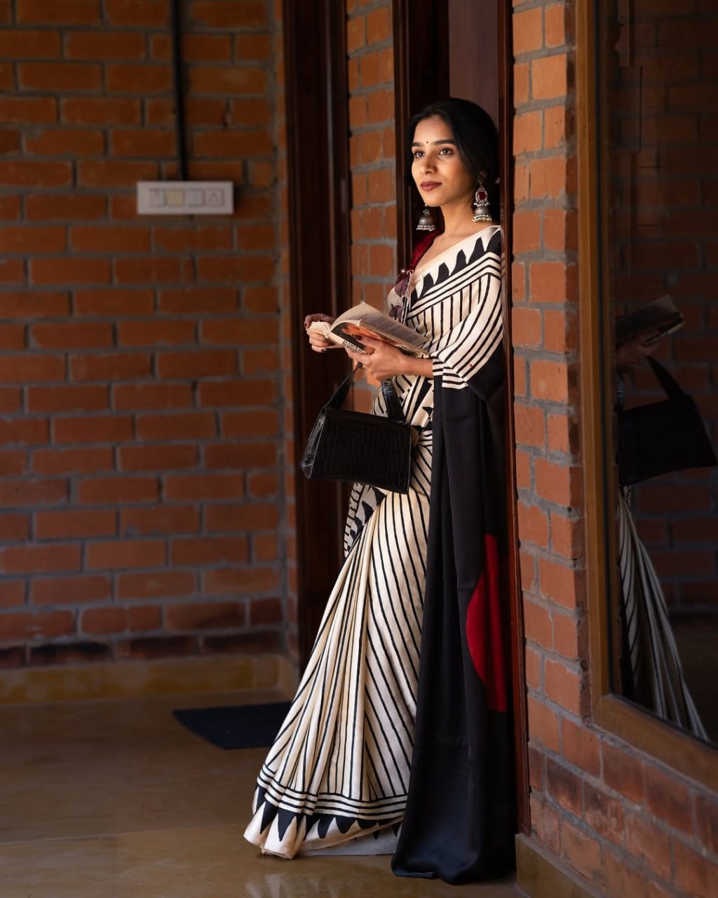 Classic Ivory & Black Striped Designer Saree with Bold Artistic Border