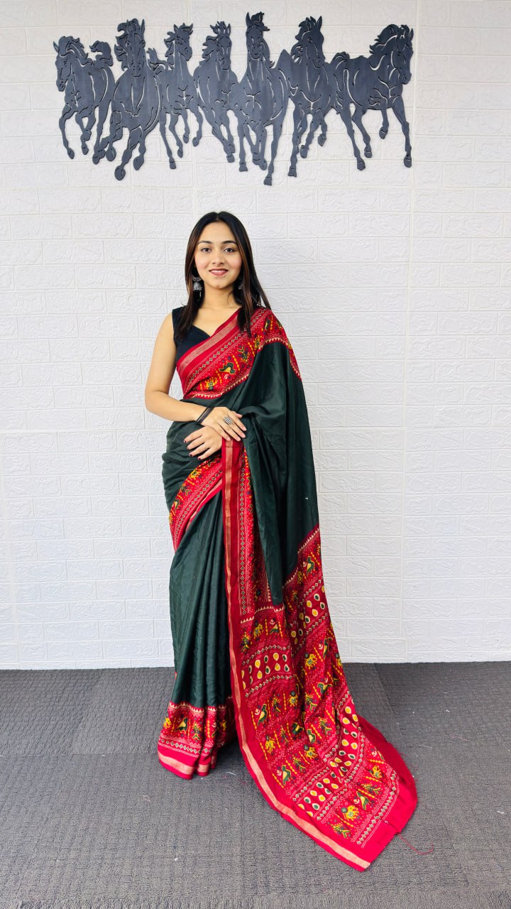 Elegant Bottle Green Designer Saree with Vibrant Red Folk Art Pallu