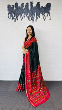 Elegant Bottle Green Designer Saree with Vibrant Red Folk Art Pallu