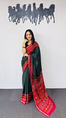 Elegant Bottle Green Designer Saree with Vibrant Red Folk Art Pallu