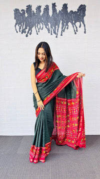 Elegant Bottle Green Designer Saree with Vibrant Red Folk Art Pallu