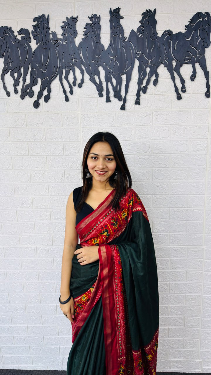 Elegant Bottle Green Designer Saree with Vibrant Red Folk Art Pallu