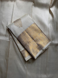 Royal Off-White Banarasi Silk Saree with Grand Gold Zari Elephant Border | Premium Wedding & Festive Wear