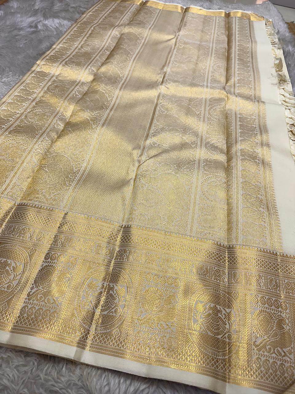 Royal Off-White Banarasi Silk Saree with Grand Gold Zari Elephant Border | Premium Wedding & Festive Wear