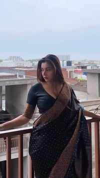 Elegant Black Georgette Saree with Antique Gold Floral Border & Butti Work