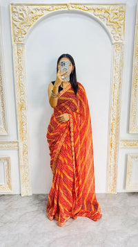 Fiery Orange Leheriya Print Saree with Elegant Embroidered Lace Border