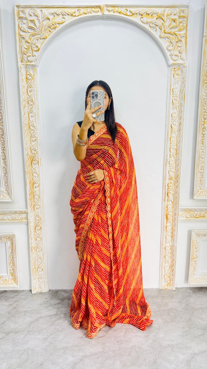 Fiery Orange Leheriya Print Saree with Elegant Embroidered Lace Border